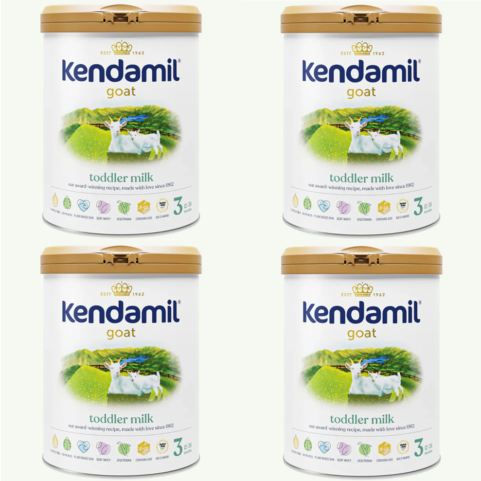 Four containers of Kendamil goat toddler milk on a white background